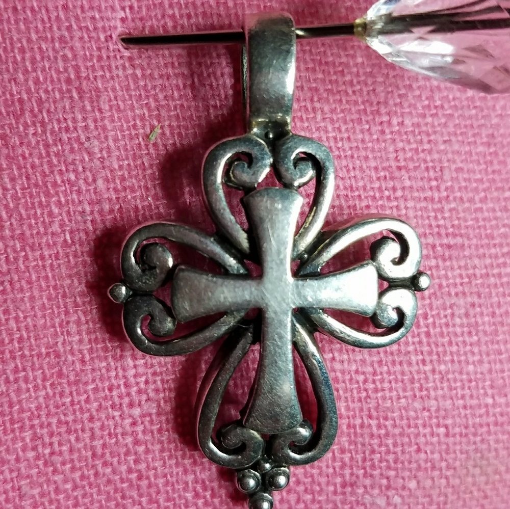 Sterling silver cross pendant.